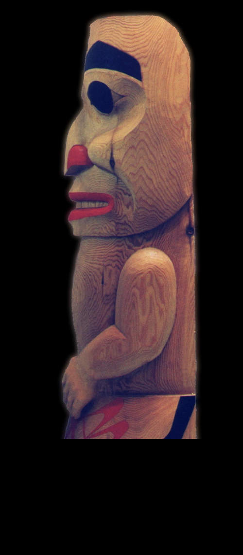 Side View of Nisga'a Shaman With Rattle Totem Pole